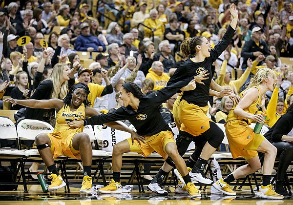 Missouri's Amber Smith, Jordan Roundtree, Kayla McDowell and Lindsey Cunningham cheer from the bench during a game last month against Mississippi at Mizzou Arena in Columbia.