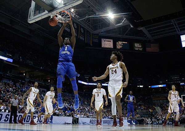 Middle Tennessee State's Brandon Walters dunks during the first half of Thursday's NCAA Tournament first-round game against Minnesota in Milwaukee. The Blue Raiders pulled off an upset win in the tournament for the second straight year.