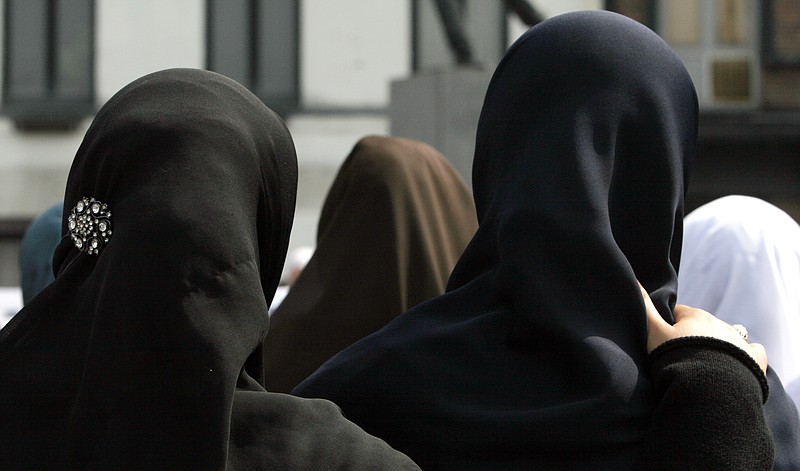 In this June 28, 2009 file photo, women gather during a demonstration in Antwerp, Belgium. Private businesses can forbid Muslim women in their employ from wearing headscarves as long as the ban is part of a policy of neutrality within the company and not a sign of prejudice against a particular religion, the European Court of Justice said on Tuesday, March 14, 2017. 