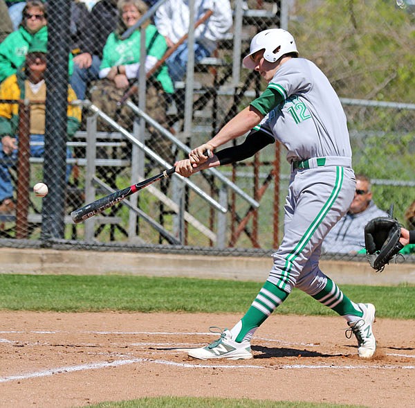 Jason Rackers of Blair Oaks hits a single during a game last season in the Capital City Invitational at Vivion Field. Rackers is one of the top returners for the Falcons this season.