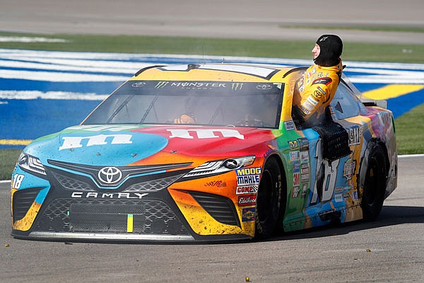 Kyle Busch climbs out of his smoking car on pit road at the end of last sunday's NASCAR Cup Series race at Las Vegas Motor Speedway in Las Vegas. Joey Logano made contact with Busch on the final lap, causing Busch to spin.