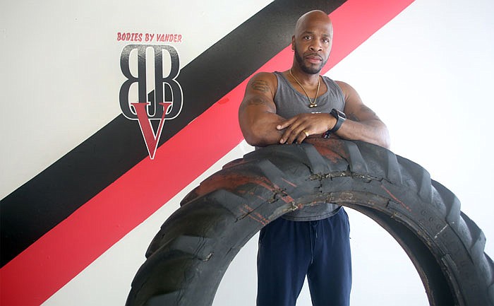 Vandderlee Hughes poses for a portrait at his business, Bodies by Vander in Jefferson City on Wednesday, February 23, 2017. The personal training gym has been in business for three years, and focuses on bootcamps and personal training sessions to help people accomplish fitness goals.