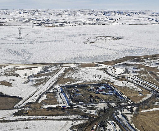 This Feb. 13, 2017, aerial file photo, shows a site where the final phase of the Dakota Access pipeline is taking place with boring equipment routing the pipeline underground and across Lake Oahe to connect with the existing pipeline in Emmons County near Cannon Ball, N.D. 