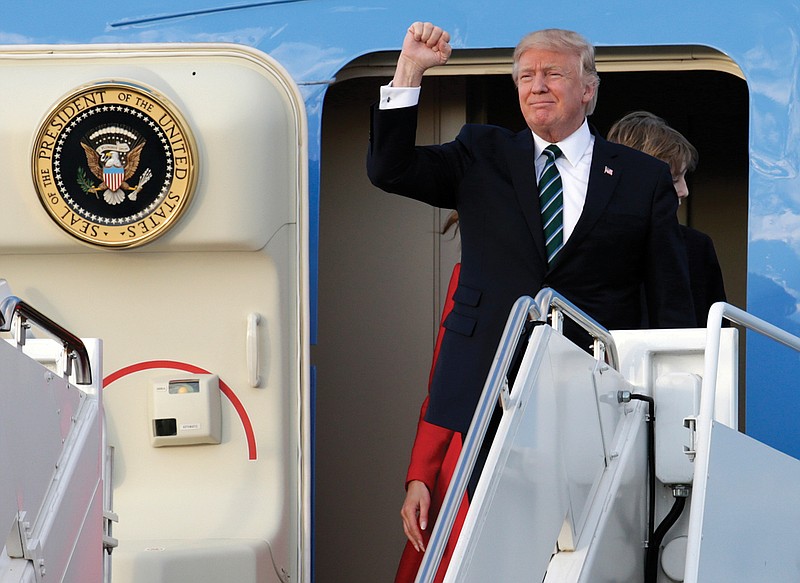 President Donald Trump arrives on Air Force One at the Palm Beach International Airport, Friday, March 17, 2017, in West Palm Beach, Fla. Trump is spending the weekend at his Mar-a-Lago Estate in Palm Beach. 