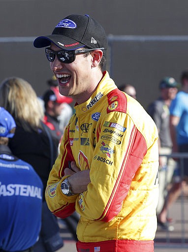 Joey Logano waits to qualify for Sunday's NASCAR Cup Series auto race, Friday, March 17, 2017, in Avondale, Ariz. 