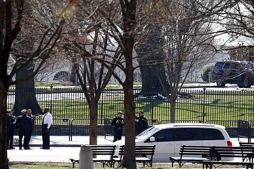 US Secret Service officers stand in the cordoned off area on Pennsylvania Avenue after a security incident near the fence of the White House in Washington, Saturday, March 18, 2017. President Trump was not at the White House at the time of the incident. 