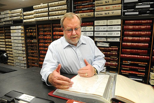 In this Feb. 22, 2017 photo, Taylor County Clerk Larry Bevill oversees the preservation of records at the Taylor County Courthouse in Abilene, Texas. 