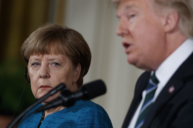 German Chancellor Angela Merkel listens as President Donald Trump speaks during their joint news conference in the East Room of the White House in Washington, Friday, March 17, 2017.