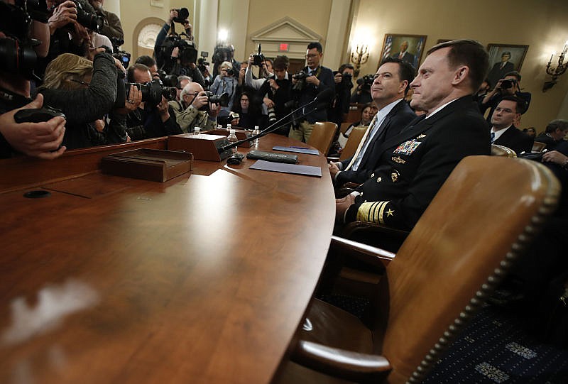 FBI Director James Comey and National Security Agency Director Michael Rogers, right, prepare to testify on Capitol Hill in Washington, Monday, March 20, 2017, before the House Intelligence Committee hearing on allegations of Russian interference in the 2016 U.S. presidential election.