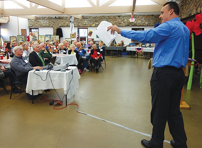 At right, Jeremy Amick, assistant director of the Missouri Office of Veterans Employment and Training, spoke about World War I soldiers from Cole County who died during World War I. He spoke Sunday evening at the 34th annual meeting of Historic City of Jefferson, held at the McClung Park indoor pavilion.