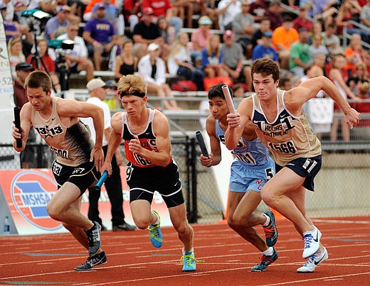 Chandler Luebbert of Helias (far right) takes off from the stripe at the sound of the gun while running first leg for the Crusaders in the Class 4 boys 4x800-meter relay at the state championships last year at Adkins Stadium.