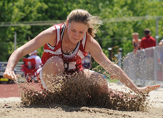 Samantha Gunn of Calvary Lutheran splashes down in the pit while competing in the Class 1 girls long jump last year in the state championships at Adkins Stadium.