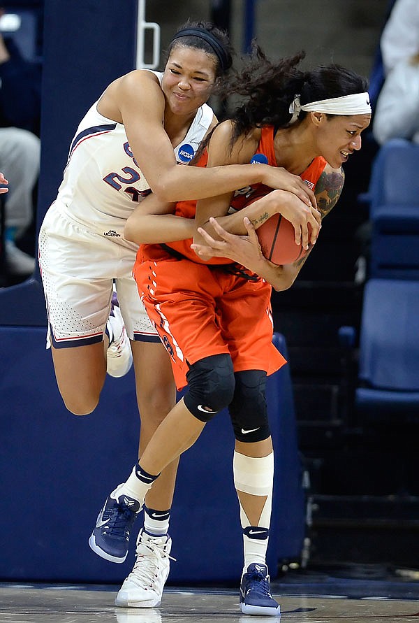 Connecticut's Napheesa Collier and Syracuse's Briana Day compete for a rebound during the second half of Monday's second-round game in the NCAA Tournament in Storrs, Conn.