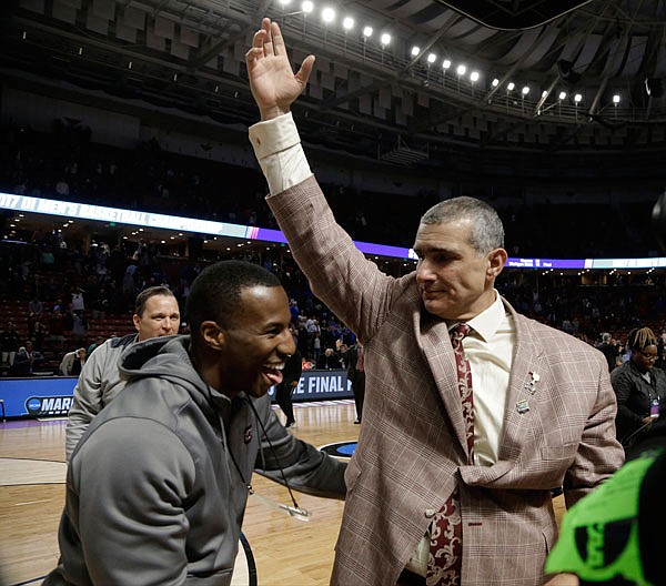 South Carolina head coach Frank Martin celebrates after Sunday's second-round game against Duke in the NCAA Tournament in Greenville, S.C. The Gamecocks are one of three SEC teams to reach the Sweet 16 this year.