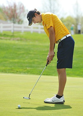 Helias' Jack Rundle putts on the 9th hole during the Helias Invitational last year at Meadow Lake Acres Country Club.