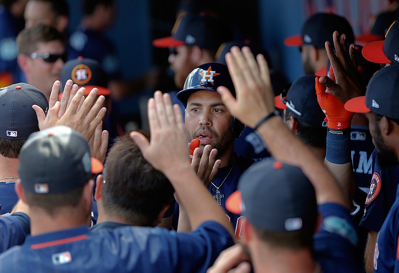 Houston Astros right fielder Carlos Beltran (15) celebratesin the dugout after hitting a home run against the Washington Nationals a spring training baseball game Tuesday, Feb. 28, 2017 in West Palm Beach, Fla.