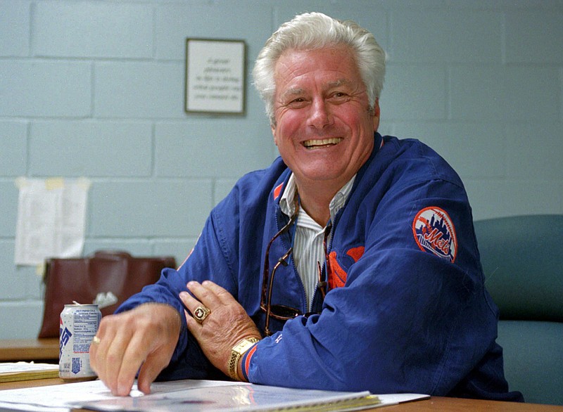 In this Feb. 14, 1996, file photo,  New York Mets manager Dallas Green smiles as he holds an informal news conference in his office at the Mets' spring training complex in Port St. Lucie, Fla. Green, the tough-talking manager who guided the Philadelphia Phillies to their first World Series championship, died Wednesday, March 22, 2017, at Hahnemann University Hospital in Philadelphia, the Phillies said. He was 82. Green spent 62 years in baseball as a player, manager, general manager, team president and other roles.