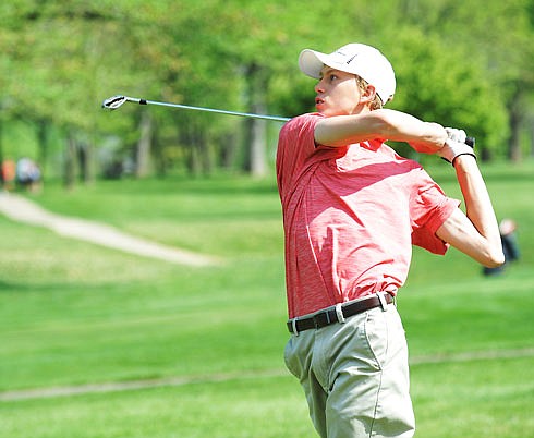 Nathan Erickson of Jefferson City watches his shot during the Capital City Invitational last year at Meadow Lake Acres Country Club.