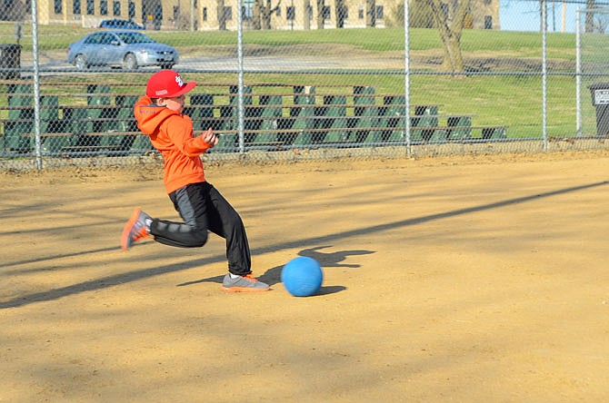 Peyton Harrison kicks for the fences during practice Wednesday for his team, the Firebirds.The Firebirds are a kindergarten to fourth-grade team participating in the Fulton Parks & Recreation's youth kickball league.