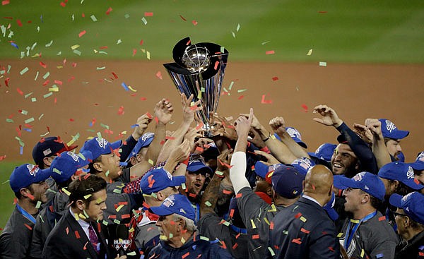 The U.S. team celebrates an 8-0 win against Puerto Rico in the final of the World Baseball Classic on Wednesday at Dodger Stadium in Los Angeles.