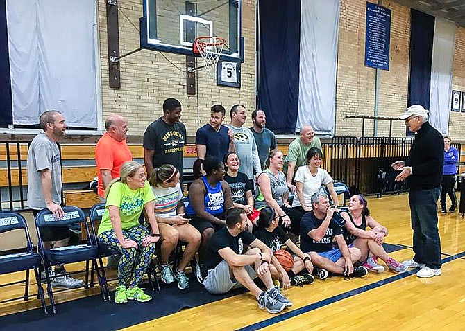 Callaway Hoopsters coach Charlie James (right) gives his team a pep talk during practice. The Callaway Hoopsters will take on the Harlem Ambassadors at 3 p.m. Sunday at Westminster College.