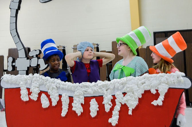McIntire Elementary fifth-graders Jaron Cowans (right), Ethan Milius, Chloe Broadway and Emma Oglesby practice their lines Wednesday during a dress rehearsal for "Seussical the Musical." The play, which stars 55 students from second to fifth grade, begins at 7 p.m. tonight at Westminster College's Champ Auditorium. Doors to this public performance open at 6:15 p.m.