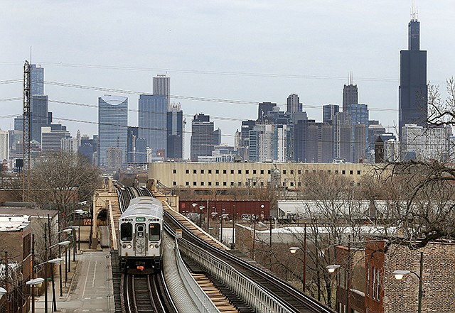 A Chicago Transit Authority Green Line train travels Thursday away from downtown Chicago. Census data shows the Chicago region has lost more residents than any other U.S. metropolitan area, a drop that comes as other Midwestern cities lost population and South and Southwest parts of the country saw gains.