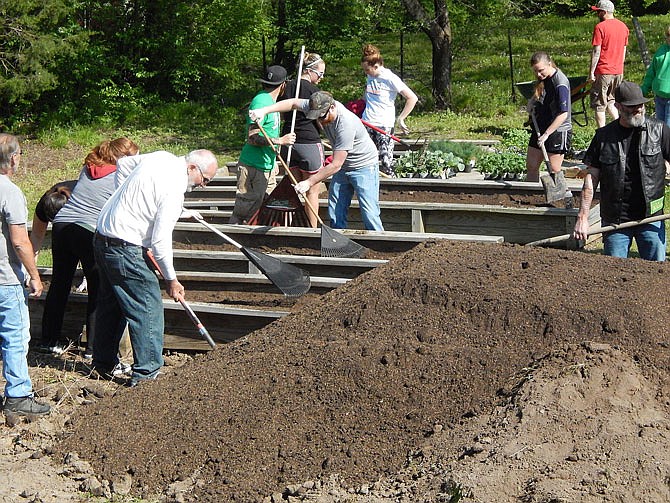 Volunteers plant last summer's garden at Our House, the homeless shelter in Fulton.