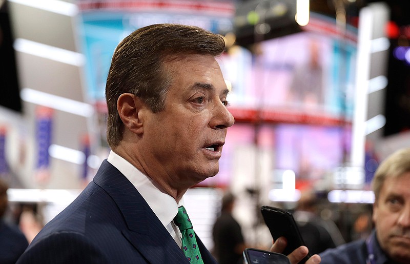 In this July 17, 2016, file photo, then-Trump campaign chairman Paul Manafort talks to reporters on the floor of the Republican National Convention in Cleveland. U.S. Treasury Department agents have recently obtained information about offshore financial transactions involving Manafort, as part of a federal anti-corruption probe into his work in Eastern Europe, The Associated Press has learned. 
