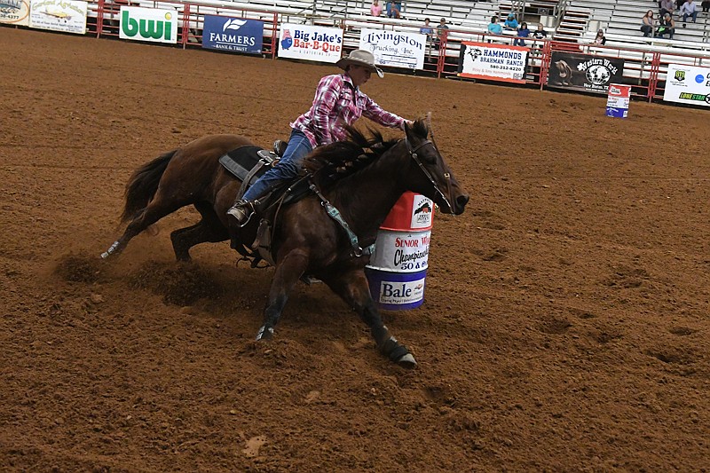 Donna Hodges competes in the second day of races at the second annual Senior World Championship Barrel Races Friday at the Four States Entertainment Center in Texarkana. 