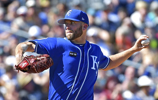 Kansas City Royals starting pitcher Danny Duffy throws against the Seattle Mariners during a spring training baseball game Friday, March 24, 2017, in Peoria, Ariz. (John Sleezer/The Kansas City Star via AP)