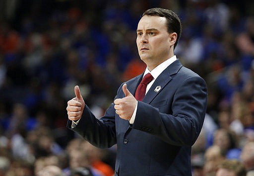  In this March 29, 2014, file photo, Dayton head coach Archie Miller gestures during the first half in a regional final game at the NCAA college basketball tournament against Florida in Memphis, Tenn. Indiana has hired Miller as its new coach on Saturday, March 25, 2017. 
