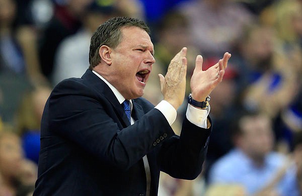 Kansas coach Bill Self applauds his team during the first half of Thursday's Midwest Regional semifinal against Purdue in Kansas City.