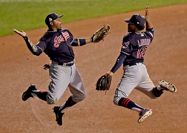 In this Oct. 29, 2016, file photo, Indians left fielder Rajai Davis (left) and shortstop Francisco Lindor celebrate their win after Game 4 of the World Series against the Cubs in Chicago.