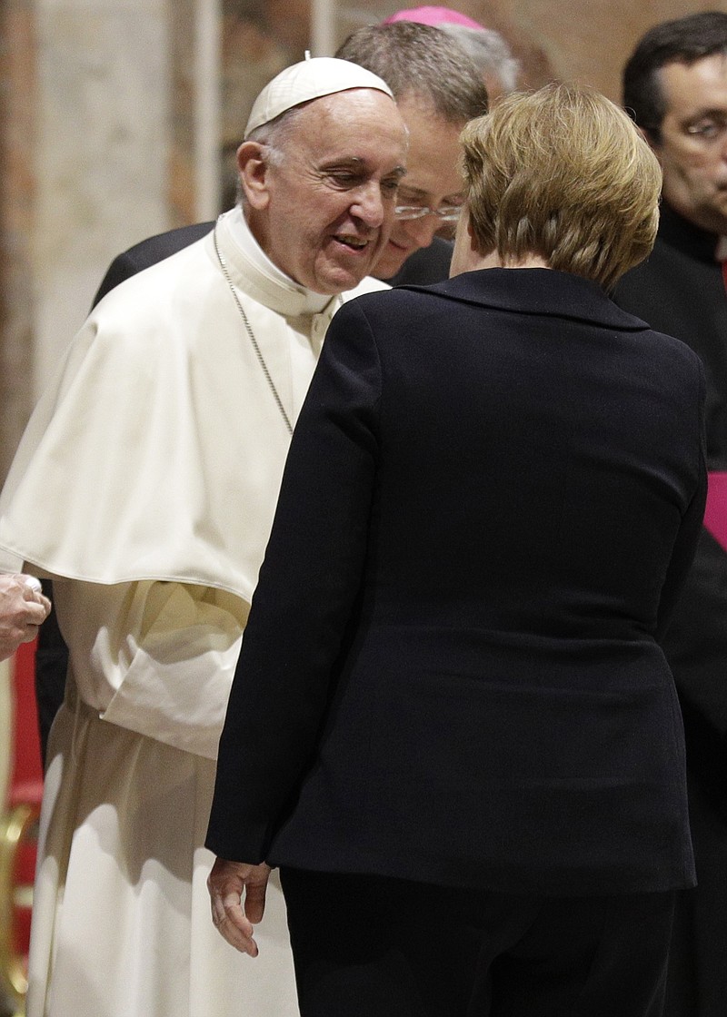 Pope Francis greets German Chancellor Angela Merkel Friday during a meeting with European Union leaders at the Vatican. Leaders of E.U. and heads of E.U. institutions were received by Pope Francis ahead of an E.U. anniversary summit.