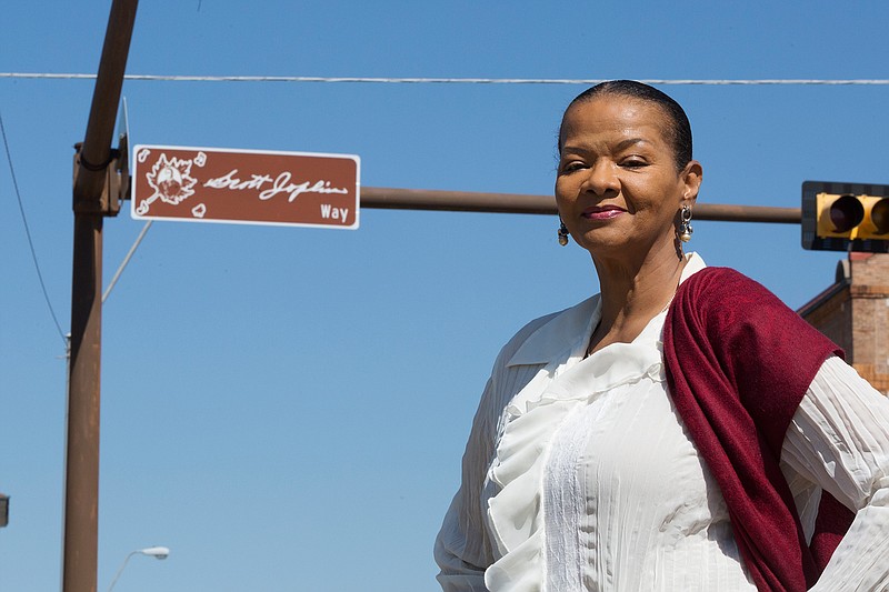 Carol Collins-Miles poses beside one of the new street signs that designate several blocks along Third Street in Texarkana as "Scott Joplin Way." The Joplin signage is a way of mapping music history here. Collins-Miles of the Scott Joplin Support Group and Regional Music Heritage Center worked with both cities to make it happen. "It is so important. We want to embrace our musical heritage," said Collins-Miles. "We're just exceedingly proud of the signs."