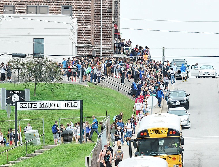 Students exit Simonsen 9th Grade Center in 2016 at the end of the school day.