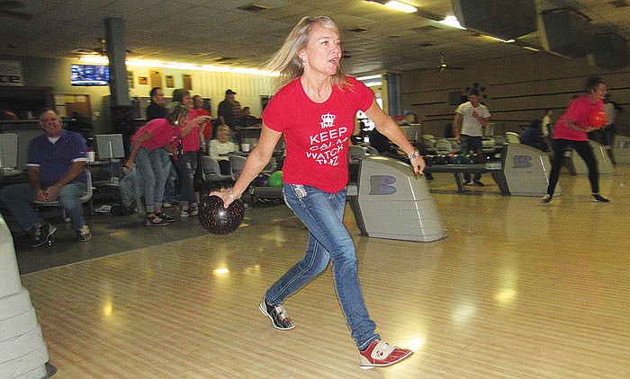 Leslie Tanner bowls as part of Sunday's Safe Ride Home program fundraiser at Capital Bowl. 