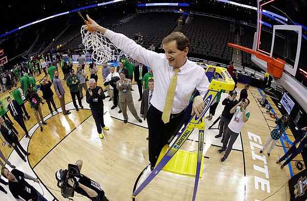 Oregon coach Dana Altman cuts down the net after the team's Midwest Regional final Saturday against Kansas in the NCAA Tournament in Kansas City. Oregon won 74-60, advancing to its first Final Four since 1939.