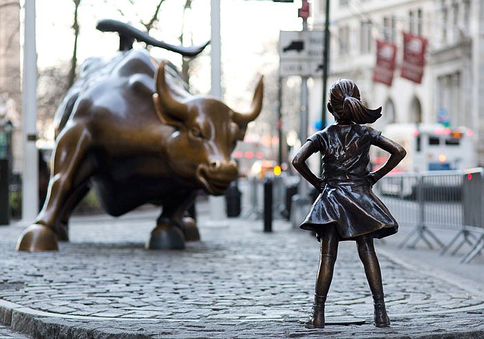 The Charging Bull and Fearless Girl statues are sit on Lower Broadway in New York. Since 1989 the bronze bull has stood in New York City's financial district as an image of the might and hard-charging spirit of Wall Street. 
