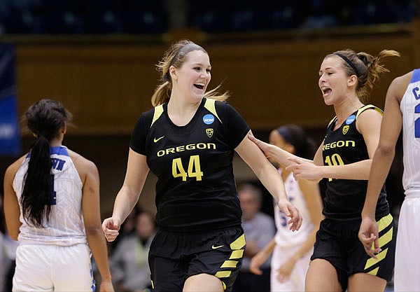 Oregon's Mallory McGwire (center) and Lexi Bando (right) celebrate following last Monday's second-round win against Duke in the women's NCAA Tournament in Durham, N.C.