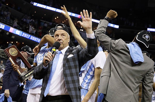 North Carolina head coach Roy Williams thanks the fans after North Carolina beat Kentucky 75-73 in Sunday's South Regional final in the NCAA Tournament in Memphis, Tenn.