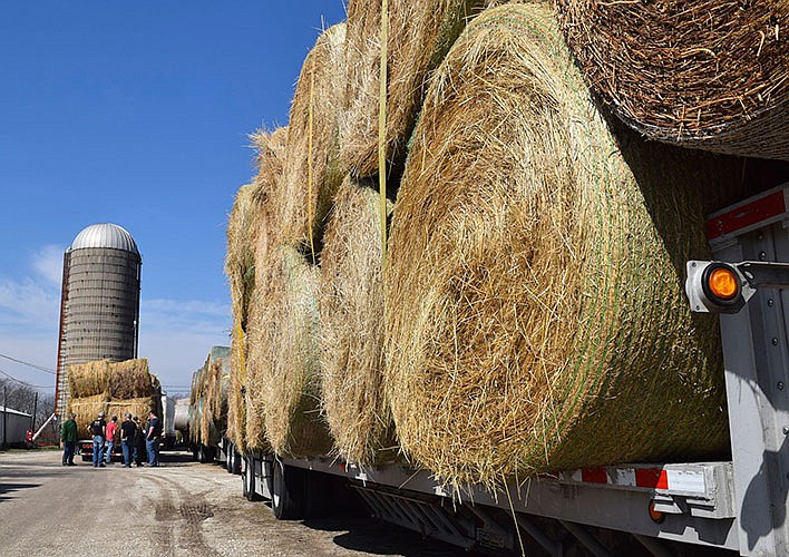The Farm Bureau Young Leaders group finish loading hay, fencing and feed supplies last week as part of a coordinated wildfire relief effort to help farmers and ranchers in Kansas. 