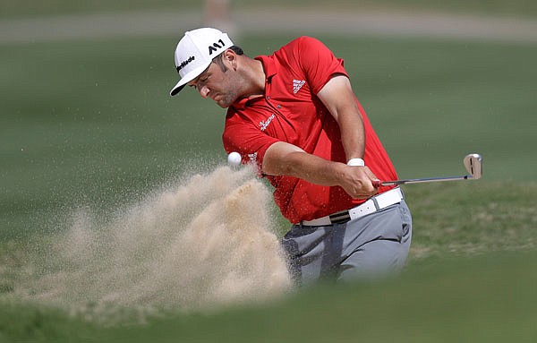 Jon Rahm plays a shot from a bunker on the 16th hole during Sunday's semifinal round in the Dell Technologies Match Play at Austin Country Club in Austin, Texas.