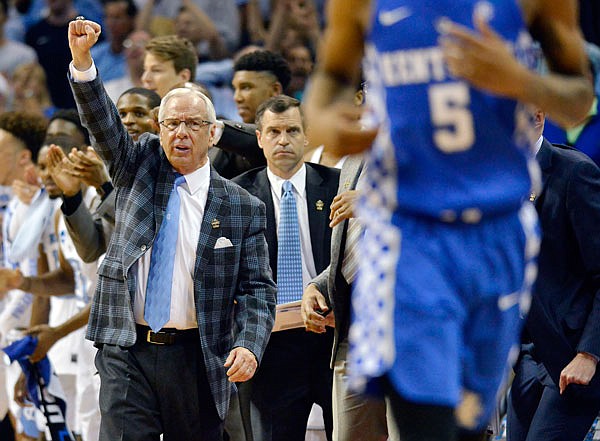 North Carolina head coach Roy Williams directs his players in the second half of Sunday's South Regional final in the NCAA Tournament against Kentucky in Memphis, Tenn.