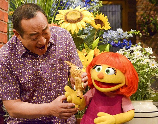 This image released by Sesame Workshop shows Julia, a new autistic muppet character debuting on the 47th Season of "Sesame Street," on April 10, 2017, on both PBS and HBO. 