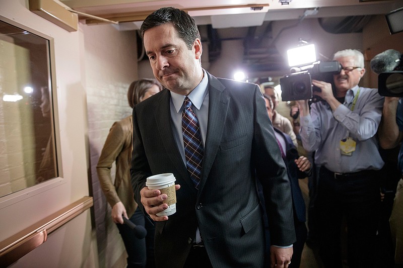 House Intelligence Committee Chairman Rep. Devin Nunes, R-Calif. is pursued by reporters as he arrives for a weekly meeting of the Republican Conference with House Speaker Paul Ryan and the GOP leadership, Tuesday, March 28, 2017, on Capitol Hill in Washington. Nunes is facing growing calls to step away from the panel's Russia investigation as revelations about a secret source meeting on White House grounds raised questions about his and the panel's independence.