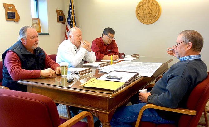 From left, Callaway County Eastern District Commissioner Randy Kleindienst, Presiding Commissioner Gary Jungermann and Western District Commissioner Roger Fischer met with road and bridge head Paul Winkelmann to discuss the annexation of part of two county roads near Holts Summit.