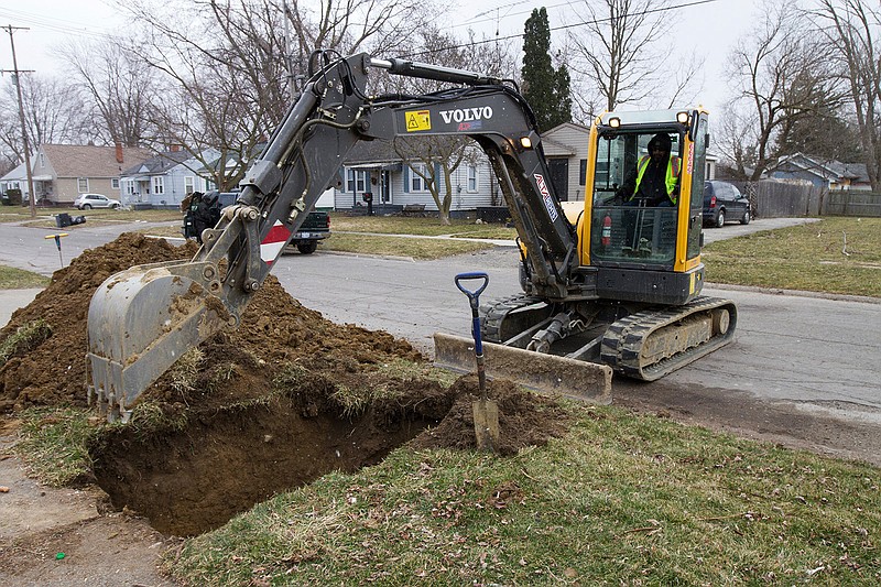 In a photo from March 10, 2017, work continues on the water replacement lines in Flint, Mich. Flint residents could still be a few years away from drinking unfiltered tap water as the city makes incremental progress on an ambitious timeframe to replace old water service lines that leached lead into homes and businesses. The project's coordinator said he has a goal of finishing the pipe replacements for residents in 2019 by fixing 6,000 service lines a year. 