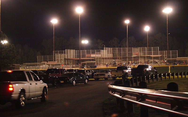 The Atlanta Sports Complex now has a professional look following a $530,000 paving and parking improvement project last summer. This is a view of opening night last Thursday for the girls' Atlanta Softball Association league play.
